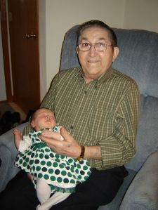 My daughter meeting Great-Grandpa at her first Christmas